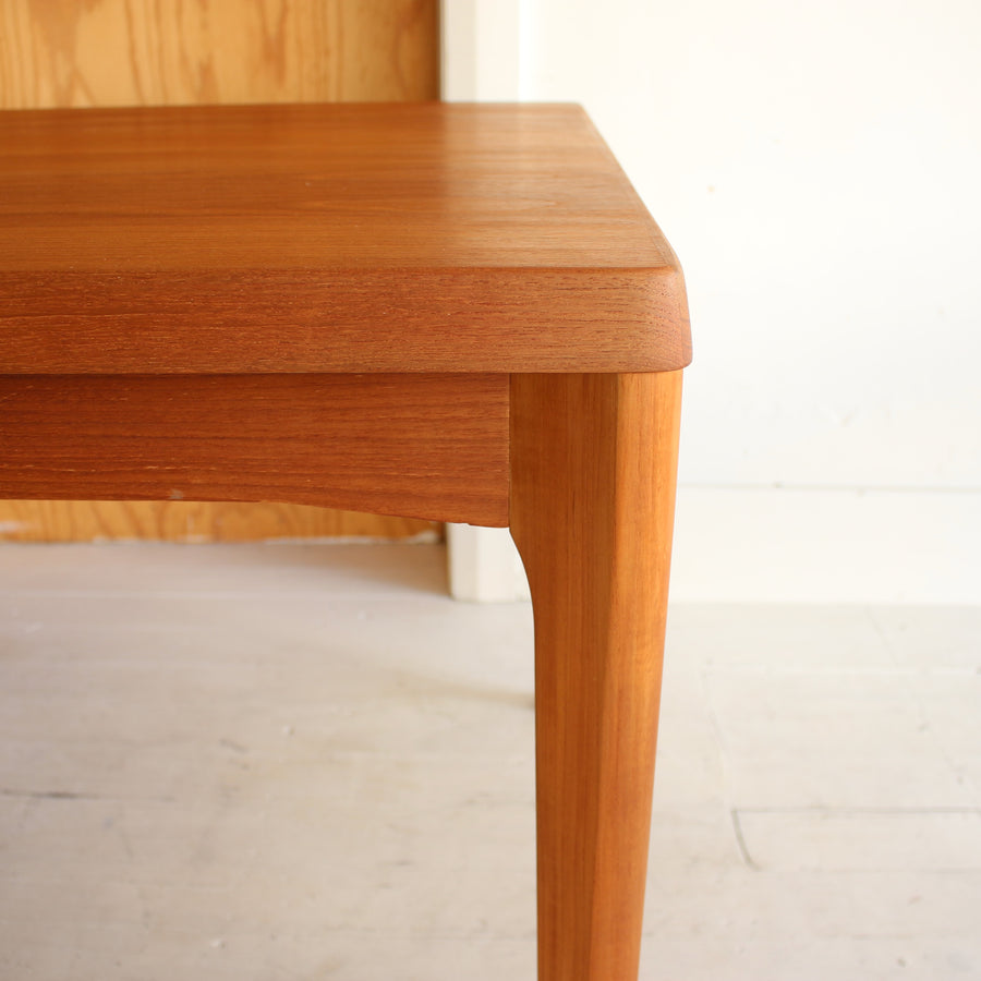 Danish teak dining table by Henning Kjærnulf