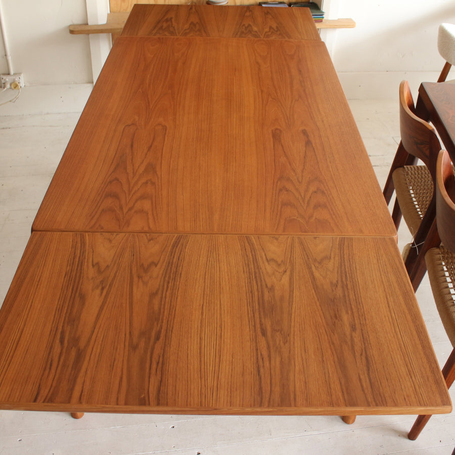 Danish teak dining table by Henning Kjærnulf