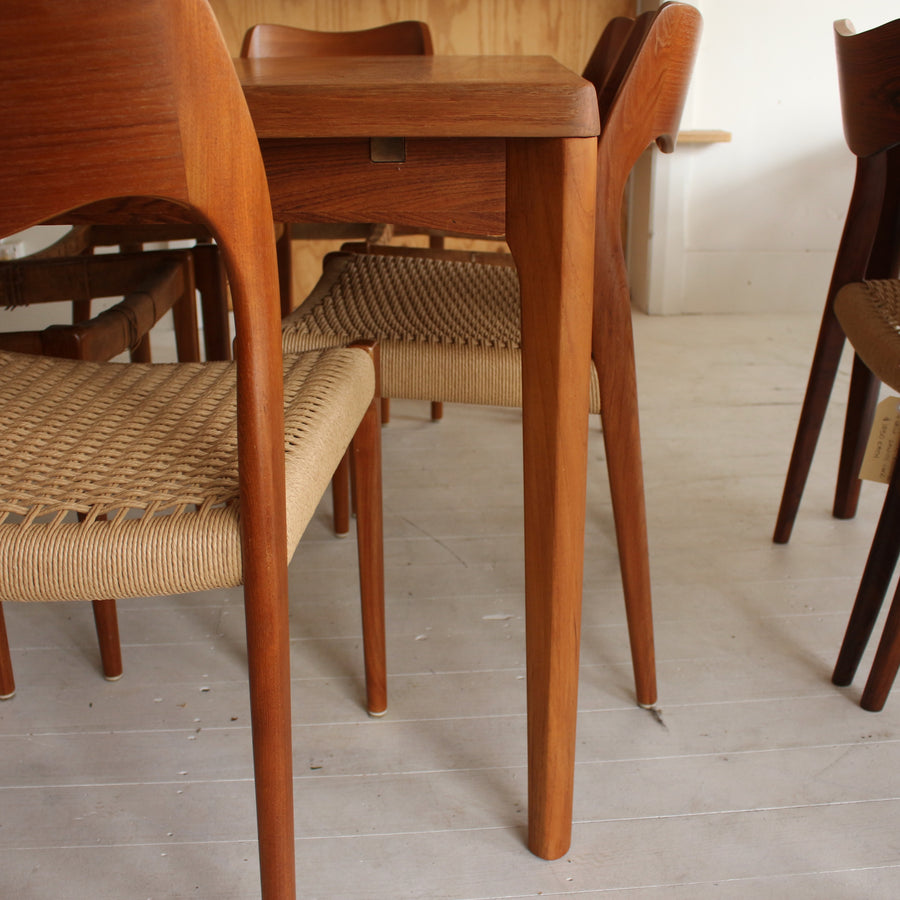 Danish teak dining table by Henning Kjærnulf