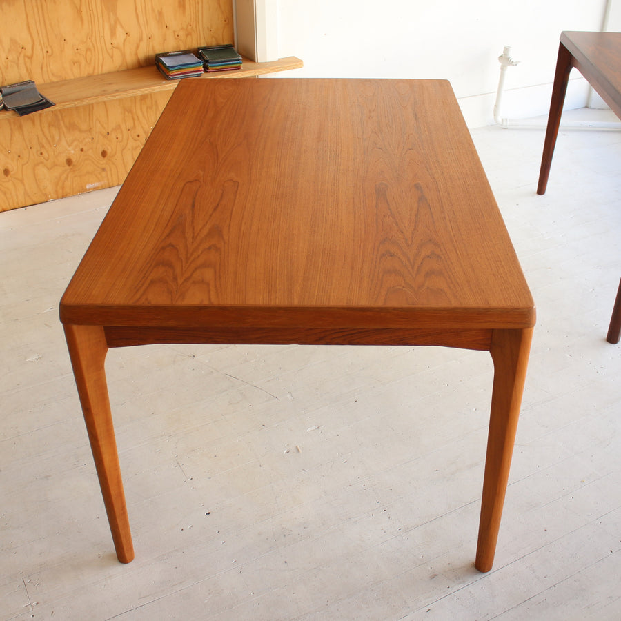 Danish teak dining table by Henning Kjærnulf