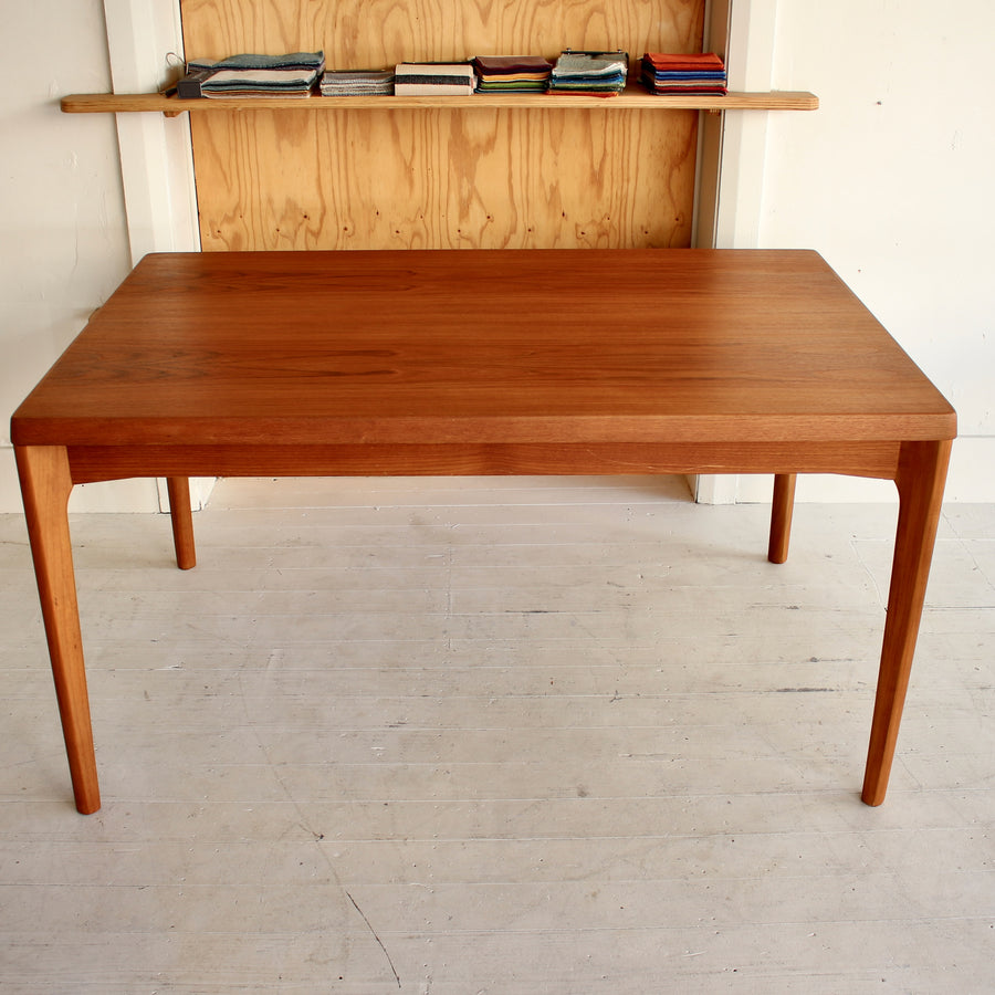 Danish teak dining table by Henning Kjærnulf