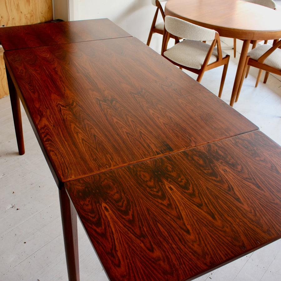 Danish mid century Brazilian rosewood dining table by Henning Kjærnulf